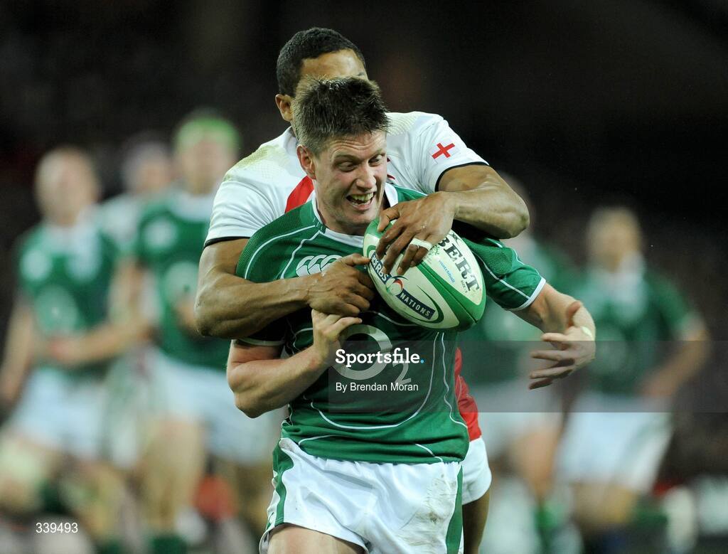 28 February 2009; Ronan O'Gara, Ireland, is tackled by Delon Armitage, England. RBS Six Nations Rugby Championship, Ireland v England, Croke Park, Dublin. Picture credit: Brendan Moran / SPORTSFILE
