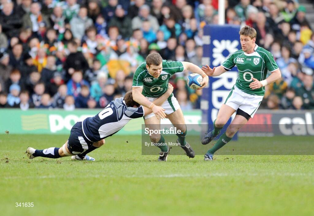 14 March 2009; Gordon D'Arcy, Ireland, supported by team-mate Ronan O'Gara, is tackled by Phil Godman, Scotland. RBS Six Nations Championship, Scotland v Ireland, Murrayfield Stadium, Edinburgh, Scotland. Picture credit: Pat Murphy / SPORTSFILE