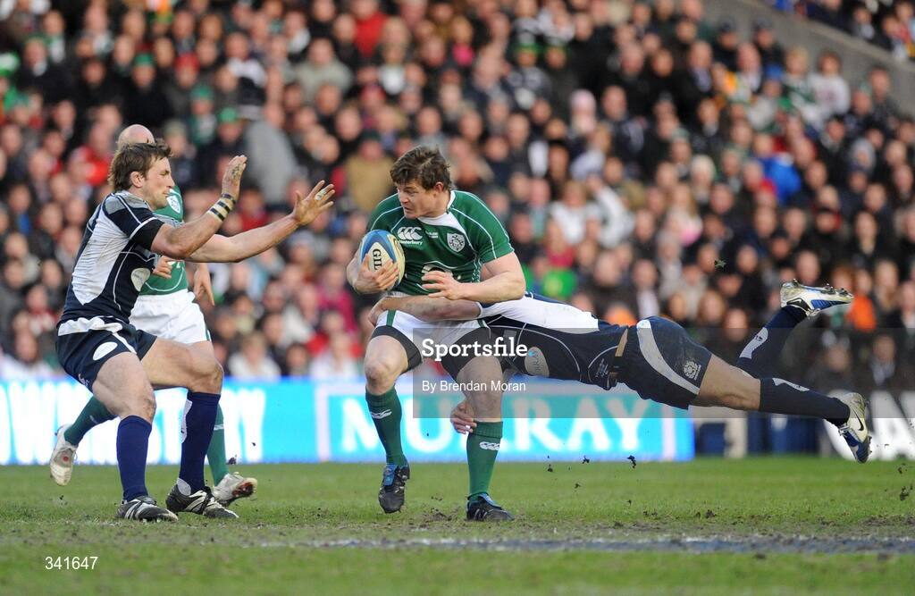 14 March 2009; Brian O'Driscoll, Ireland, is tackled by John Barclay, left, and Phil Godman, Scotland. RBS Six Nations Championship, Scotland v Ireland, Murrayfield Stadium, Edinburgh, Scotland. Picture credit: Brendan Moran / SPORTSFILE
