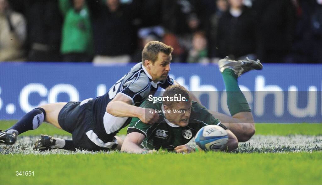 14 March 2009; Jamie Heaslip, Ireland, scores his side's try against Scotland despite the challenge of Chris Paterson. RBS Six Nations Championship, Scotland v Ireland, Murrayfield Stadium, Edinburgh, Scotland. Picture credit: Brendan Moran / SPORTSFILE
