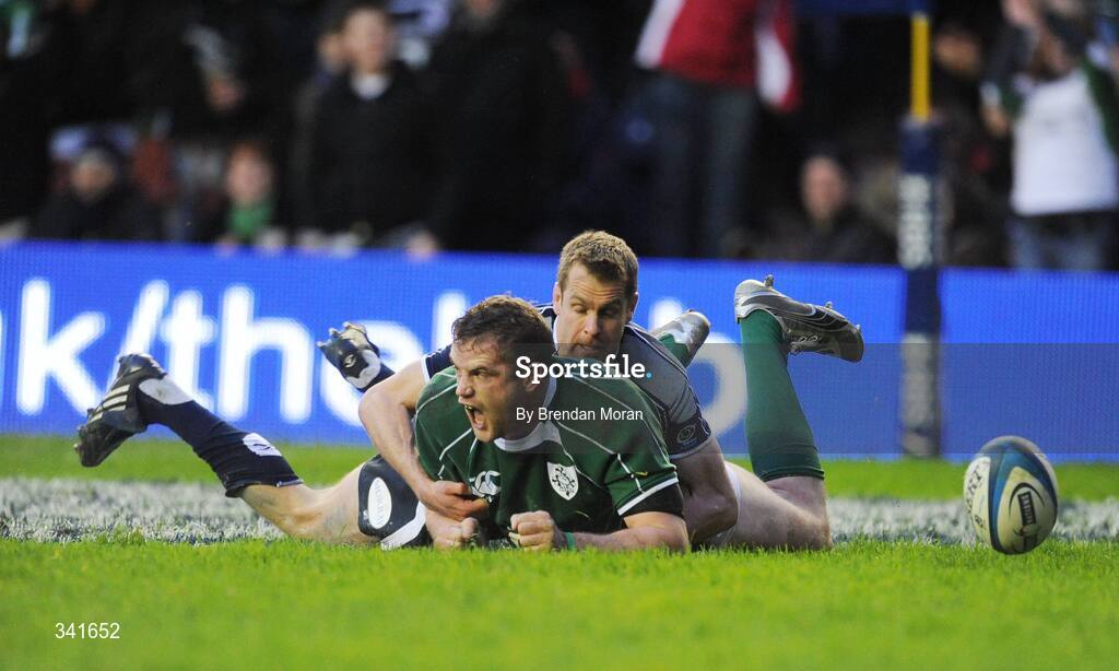 14 March 2009; Jamie Heaslip, Ireland, celebrates as he scores his side's try against Scotland despite the challenge of Chris Paterson. RBS Six Nations Championship, Scotland v Ireland, Murrayfield Stadium, Edinburgh, Scotland. Picture credit: Brendan Moran / SPORTSFILE