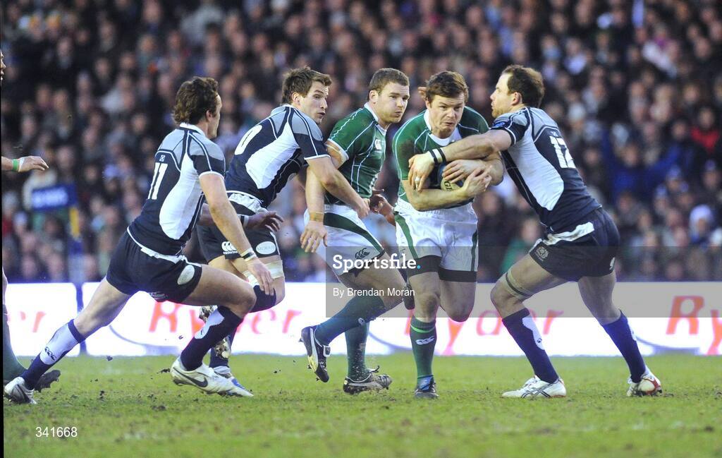 14 March 2009; Brian O'Driscoll, Ireland, breaks through the tackles of Thom Evans, left, Phil Godman and Graeme Morrison, right, Scotland. RBS Six Nations Championship, Scotland v Ireland, Murrayfield Stadium, Edinburgh, Scotland. Picture credit: Brendan Moran / SPORTSFILE