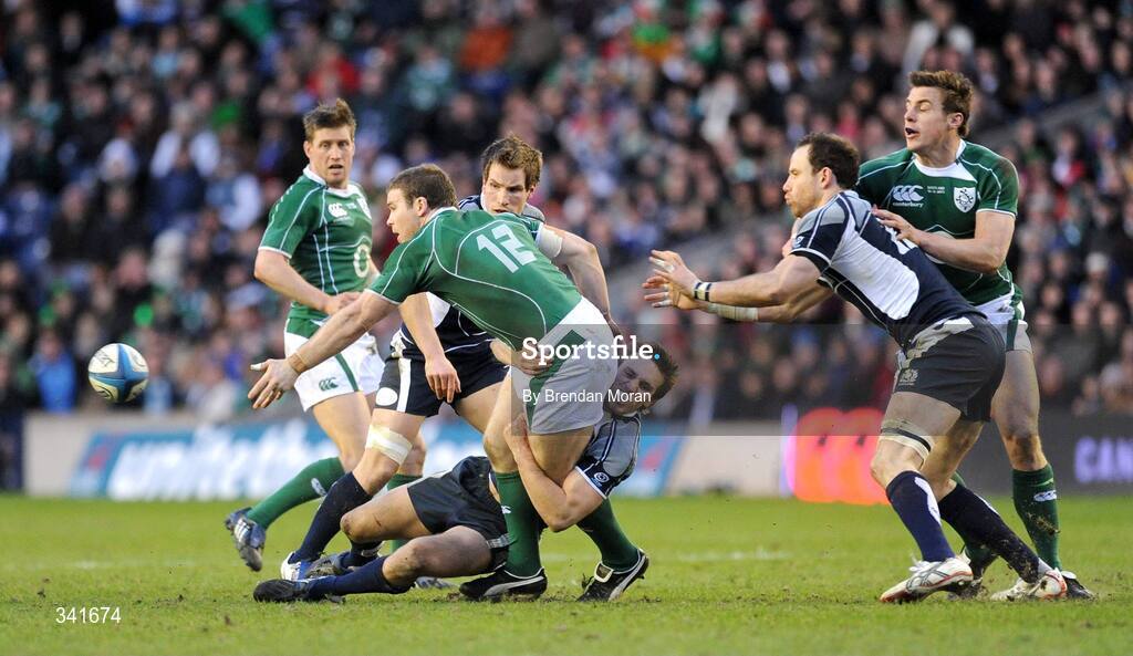 14 March 2009; Gordon D'Arcy, Ireland, offloads despite the tackle of Mike Blair, Scotland. RBS Six Nations Championship, Scotland v Ireland, Murrayfield Stadium, Edinburgh, Scotland. Picture credit: Brendan Moran / SPORTSFILE
