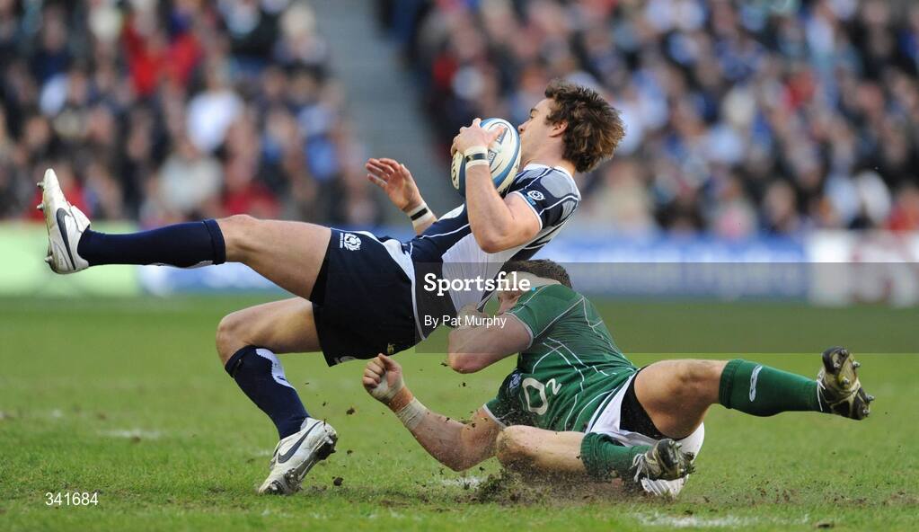 14 March 2009; Thom Evans, Scotland, is pulled down by David wallace, Ireland. RBS Six Nations Championship, Scotland v Ireland, Murrayfield Stadium, Edinburgh, Scotland. Picture credit: Pat Murphy / SPORTSFILE