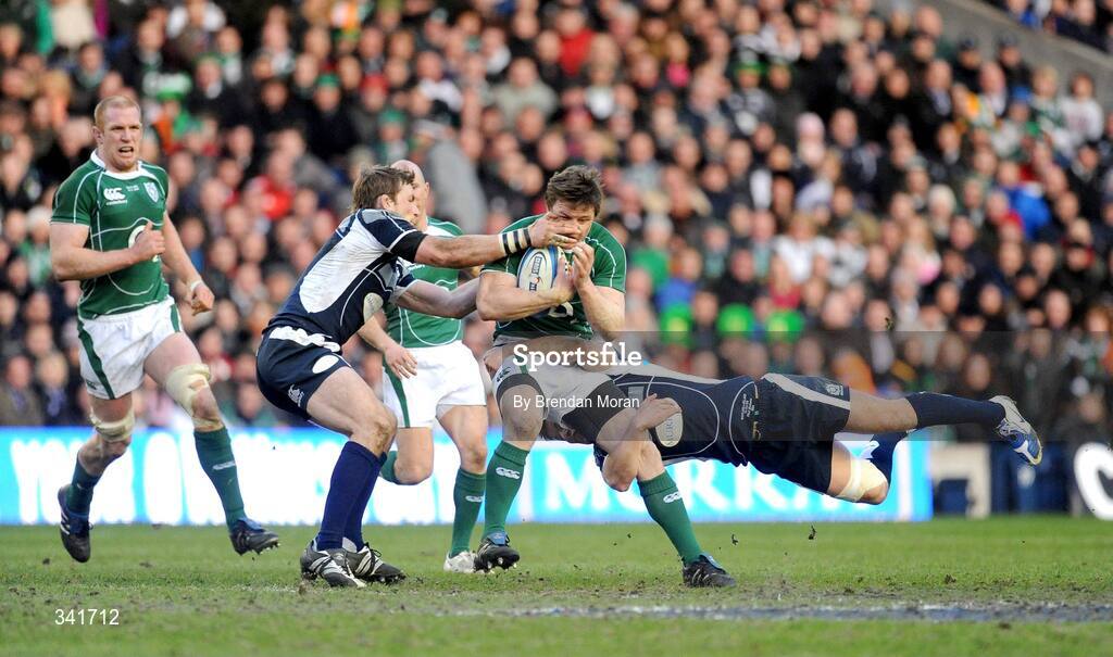 14 March 2009; Brian O'Driscoll, Ireland, is tackled by John Barclay, left, and Phil Godman, Scotland. RBS Six Nations Championship, Scotland v Ireland, Murrayfield Stadium, Edinburgh, Scotland. Picture credit: Brendan Moran / SPORTSFILE