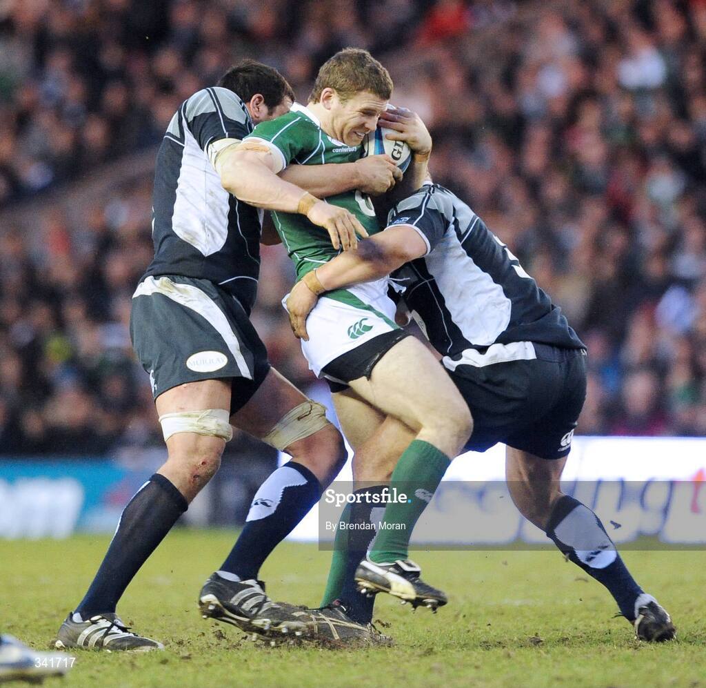 14 March 2009; Gordon D'Arcy, Ireland, is tackled by James Hamilton, left, and Euan Murray, Scotland. RBS Six Nations Championship, Scotland v Ireland, Murrayfield Stadium, Edinburgh, Scotland. Picture credit: Brendan Moran / SPORTSFILE