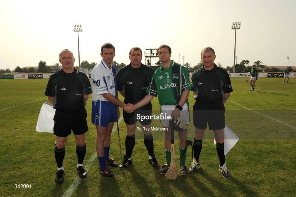 14 March 2009; Captains Andy Coen, left, Connacht, and JJ Delaney, Leinster, shake hands accross referee Michael Wadding before the game. The linesmen are Ger Devlin, Armagh, and Ger Hoey, Clare.  M Donnelly Interprovincial Hurling Final presented by Etihad Airways, Leinster v Connacht, Ghantoot Racing and Polo Club, Abu Dhabi, United Arab Emirates. Picture credit: Ray McManus / SPORTSFILE