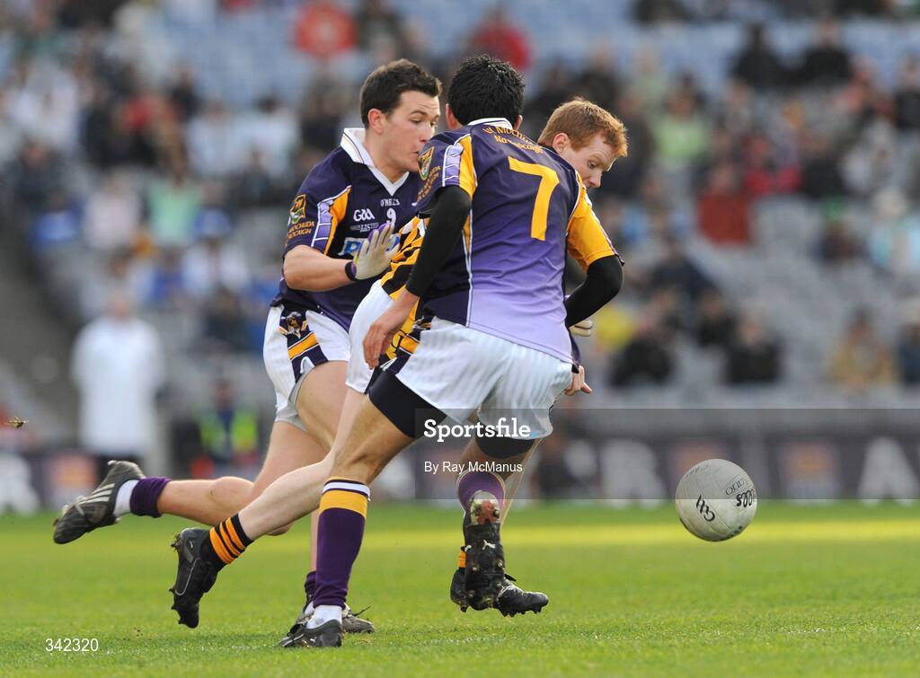 17 March 2009; Michael McEntee, Crossmaglen Rangers, in action against Cian O'Sullivan, 7, and Niall Corkery, Kilmacud Crokes. AIB All-Ireland Senior Club Football Championship Final, Crossmaglen Rangers, Co. Armagh v Kilmacud Crokes, Dublin. Croke Park, Dublin. Picture credit: Ray McManus / SPORTSFILE