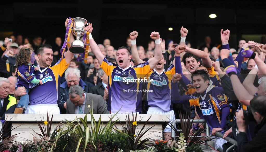 17 March 2009; Kilmacud Crokes captain Johnny Magee, holding his daughter Eabha, and Pat Burke lift the Andy Merrigan Cup after the game. AIB All-Ireland Senior Club Football Championship Final, Crossmaglen Rangers, Co. Armagh v Kilmacud Croke, Dublin. Croke Park, Dublin. Picture credit: Brendan Moran / SPORTSFILE