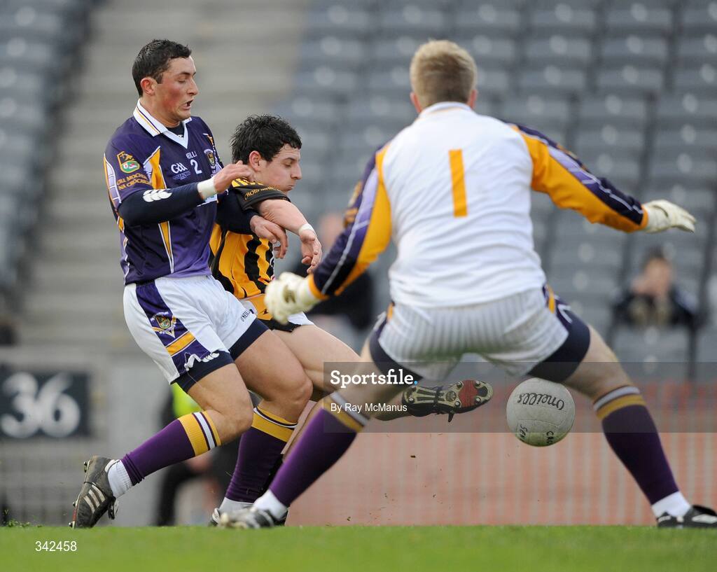 17 March 2009; The Kilmacud Crokes goalkeeper David Nestor and corner-back Ross O'carroll combine to thwart the efforts of Crossmaglen Rangers' forward Jamie Clarke as he shoots goalwards. AIB All-Ireland Senior Club Football Championship Final, Crossmaglen Rangers, Co. Armagh, v Kilmacud Crokes, Dublin. Croke Park, Dublin. Picture credit: Ray McManus / SPORTSFILE