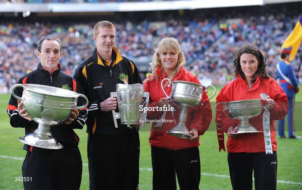 17 March 2009; The Four All-Ireland Senior Championship winning captains of 2008, from left, Brian Dooher, Tyrone, with the Sam Maguire Cup, Henry Shefflin, Kilkenny, with the Liam MacCarthy Cup, Angela Walsh, Cork, with the Brendan Martin Cup and Caitriona Foley, Cork, with the O'Duffy Cup, during the celebrations entitled 'Monumental Moments’ from the St. Patrick’s Day Festival, in Croke Park, as part of the GAA's 125th Anniversary. AIB All-Ireland Senior Club Football Championship Final, Croke Park, Dublin. Picture credit: Brendan Moran / SPORTSFILE