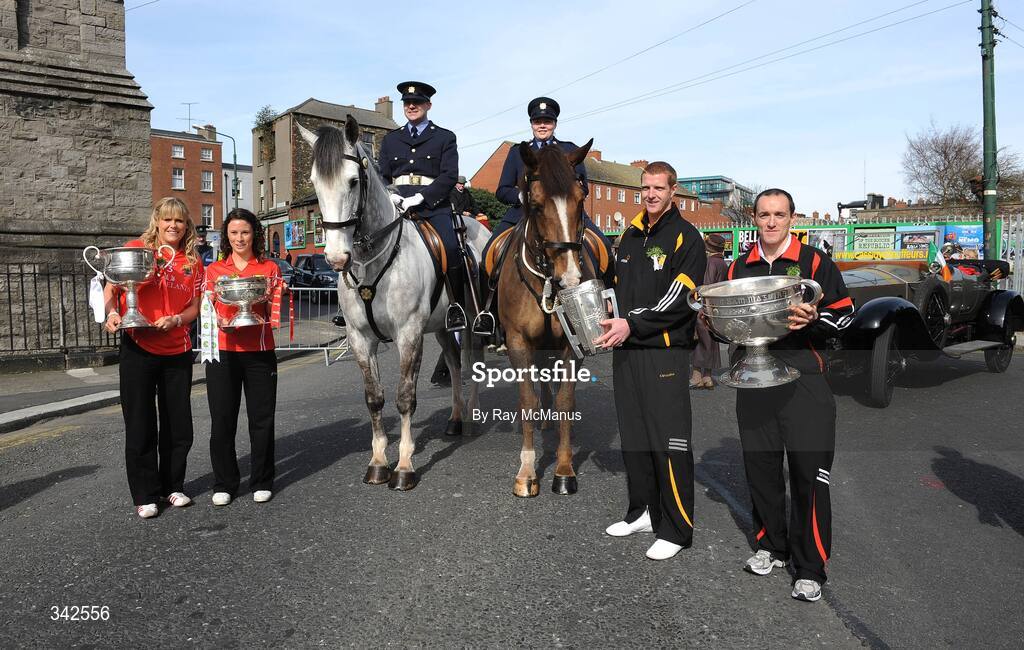 17 March 2009; The four All-Ireland Senior Championship winning captains, from left to right, Angela Walsh, Cork, with the Brendan Martin Cup, Caitriona Foley, Cork, with the O'Duffy Cup, Henry Shefflin, Kilkenny, with the Liam MacCarthy Cup and Brian Dooher, Tyrone, with the Sam Maguire Cup and members of An Garda Siochana as part of the 'Monumental Moments’ from the St. Patrick’s Day Parade, part of the GAA's 125th Anniversary. AIB All-Ireland Senior Club Football Championship Final, St Mary's Place, Dublin. Picture credit: Ray McManus / SPORTSFILE