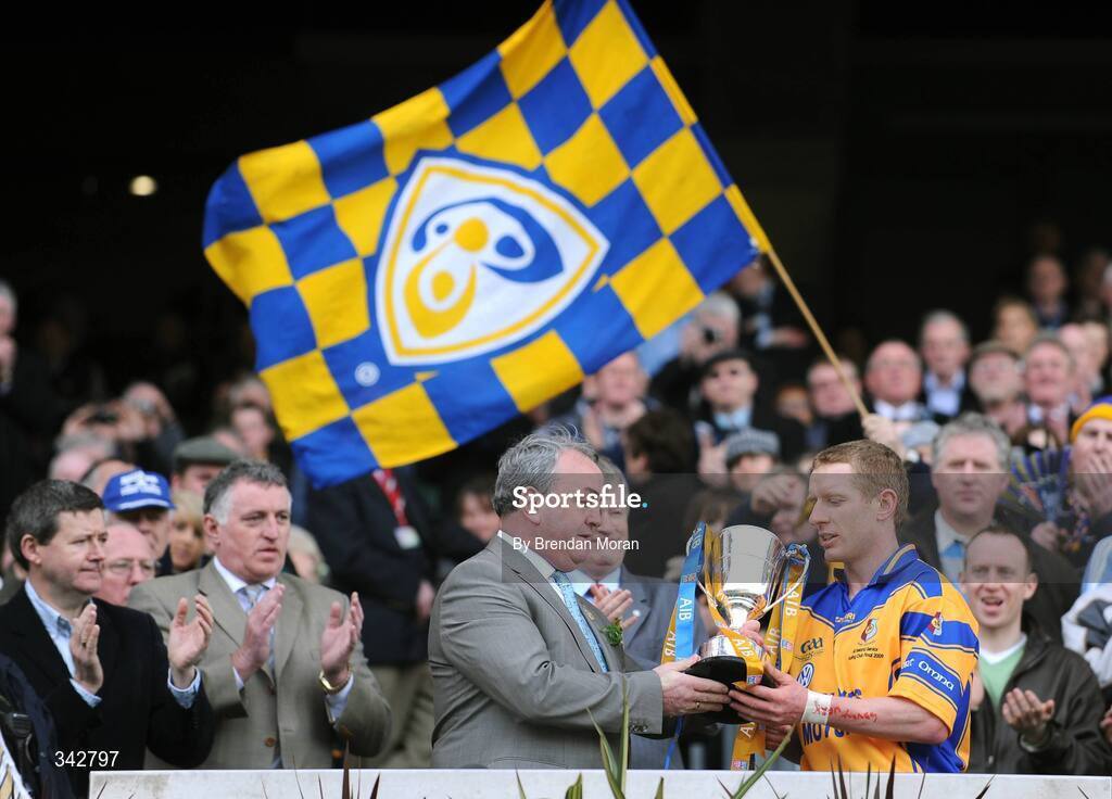 17 March 2009; Portumna captain Ollie Canning is presented with the Tommy Moore Cup by Nickey Brennan, President of the GAA, in the company of Billy Finn, left, General Manager, AIB. AIB All-Ireland Senior Club Hurling Championship Final, Portumna, Co. Galway v De La Salle, Waterford, Croke Park, Dublin. Picture credit: Brendan Moran / SPORTSFILE