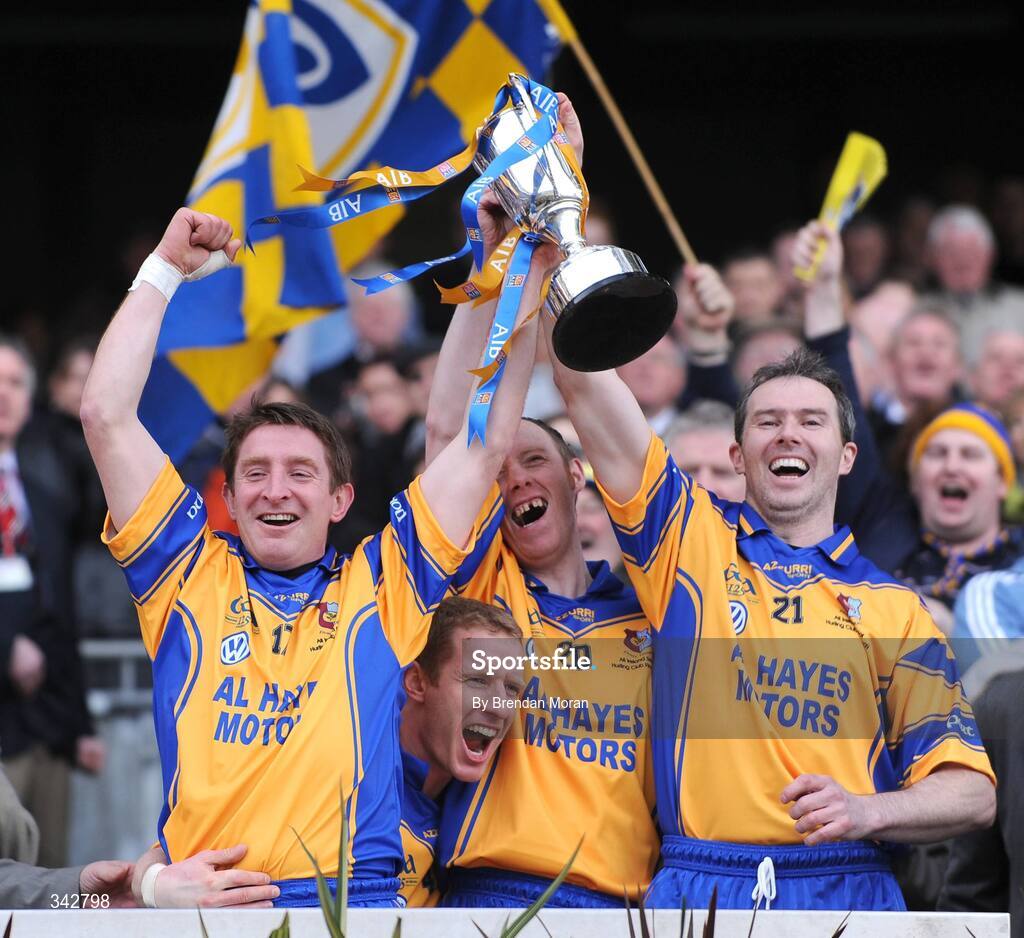 17 March 2009; Portumna players, from left, David canning, Ollie Canning, Mike Gill and Pierce Tracey celebrate with the Tommy Moore Cup after the game. AIB All-Ireland Senior Club Hurling Championship Final, Portumna, Co. Galway v De La Salle, Waterford, Croke Park, Dublin. Picture credit: Brendan Moran / SPORTSFILE