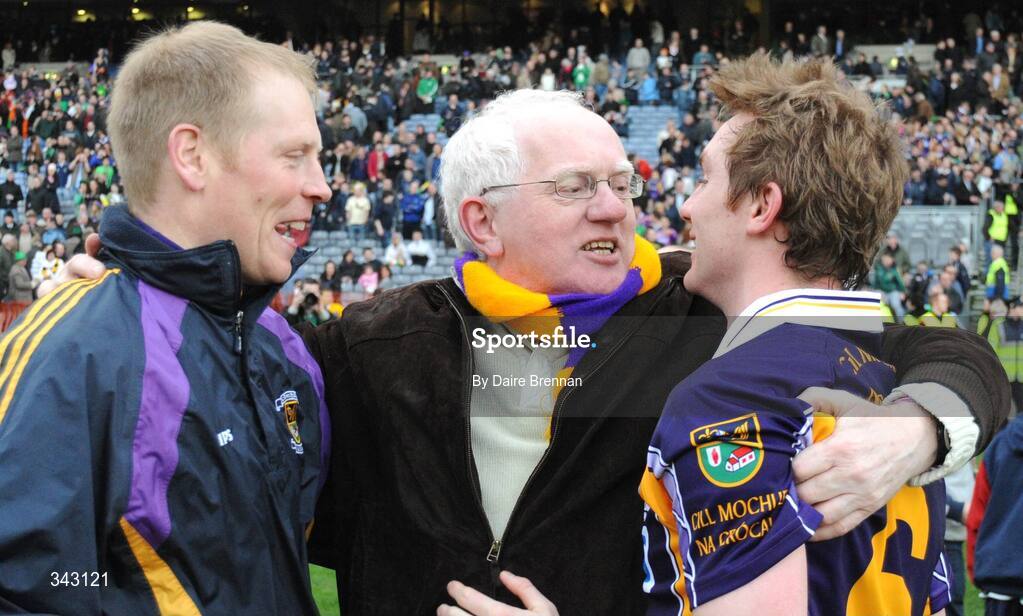 17 March 2009; Former Kilmacud Crokes chairman Pauric McMenamin congratulates players Liam McBarron, left, and Paul Griffin after the game. All-Ireland Senior Club Football Championship Final, Crossmaglen Rangers v Kilmacud Crokes. Croke Park, Dublin. Picture credit: Daire Brennan / SPORTSFILE