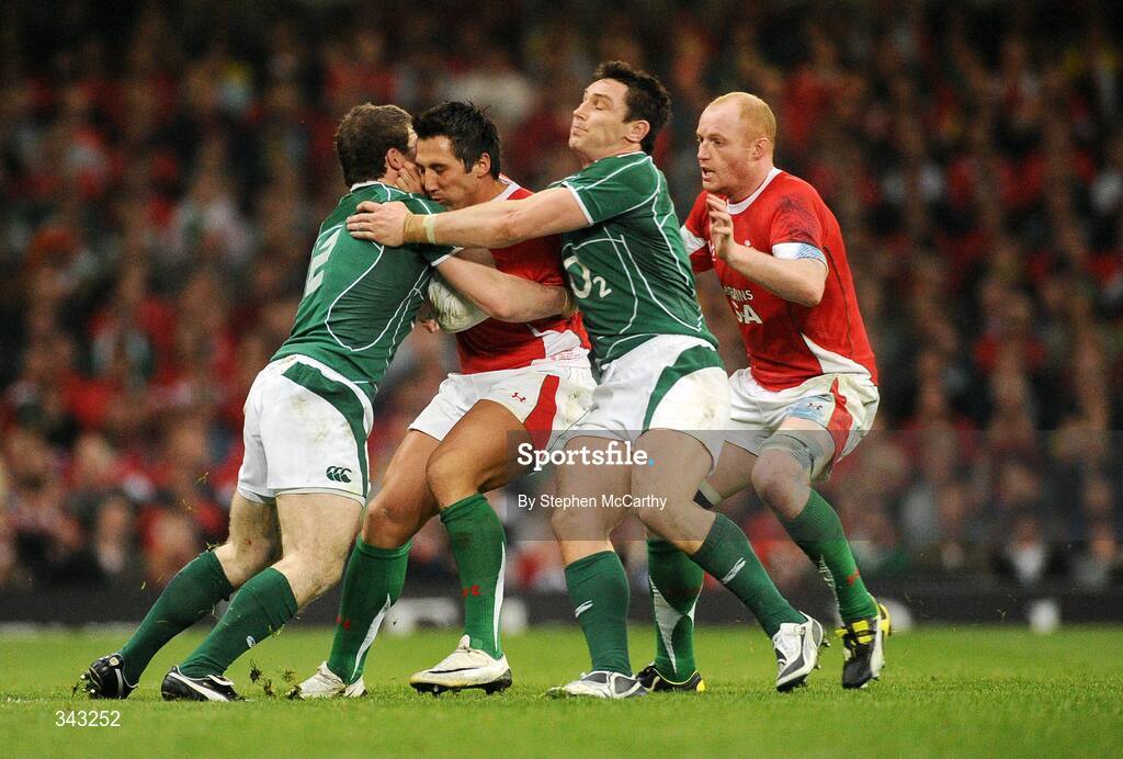21 March 2009; Gavin Henson, Wales, is tackled by Gordon D'Arcy, left, and David Wallace, Ireland. RBS Six Nations Championship, Wales v Ireland, Millennium Stadium, Cardiff, Wales. Picture credit: Stephen McCarthy / SPORTSFILE