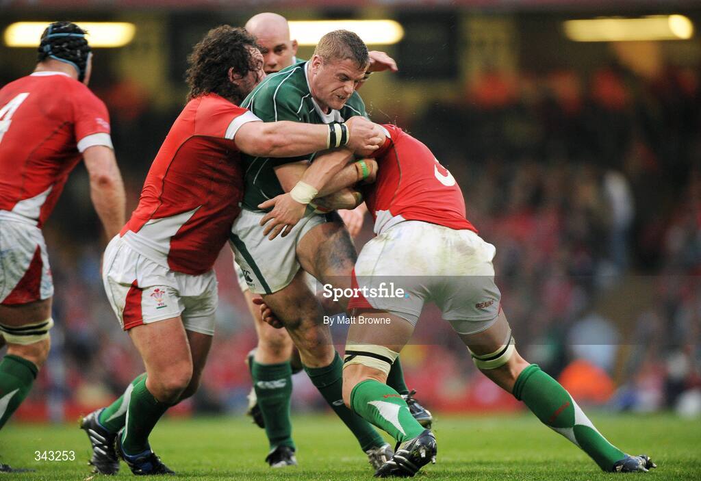 21 March 2009; Jamie Heaslip, Ireland, is tackled by Adam Jones, left, and Alun-Wyn Jones, Wales. RBS Six Nations Championship, Wales v Ireland, Millennium Stadium, Cardiff, Wales. Picture credit: Matt Browne / SPORTSFILE