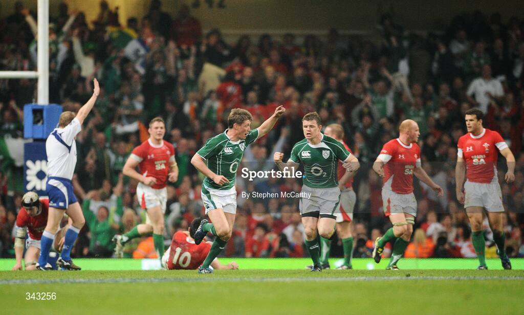 21 March 2009; Ireland's Ronan O'Gara, left, celebrates with team-mate Brian O'Driscoll after scoring a drop goal to make the score Wales 15 - Ireland 17. RBS Six Nations Championship, Wales v Ireland, Millennium Stadium, Cardiff, Wales. Picture credit: Stephen McCarthy / SPORTSFILE