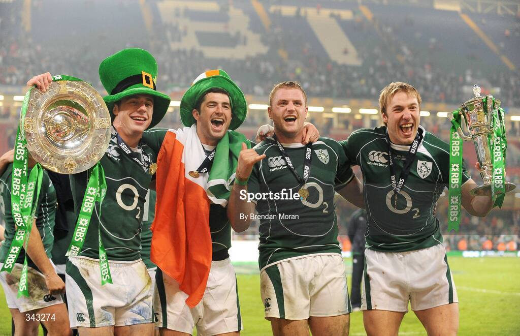21 March 2009; Ireland players, from left, Tommy Bowe, Rob Kearney, Jamie Heaslip and Stephen Ferris celebrate with the Triple Crown trophy and the RBS Six Nations trophy. RBS Six Nations Championship, Wales v Ireland, Millennium Stadium, Cardiff, Wales. Picture credit: Brendan Moran / SPORTSFILE