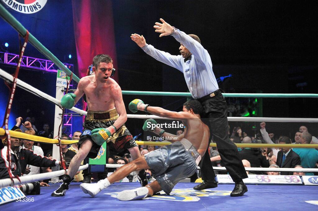 21 March 2009; Bernard Dunne knocks down Ricardo Cordoba during the eleventh round to win the WBA World Super Bantamweight title. Hunky Dory World Title Fight Night, Bernard Dunne v Ricardo Cordoba, The O2, Dublin. Picture credit: David Maher / SPORTSFILE