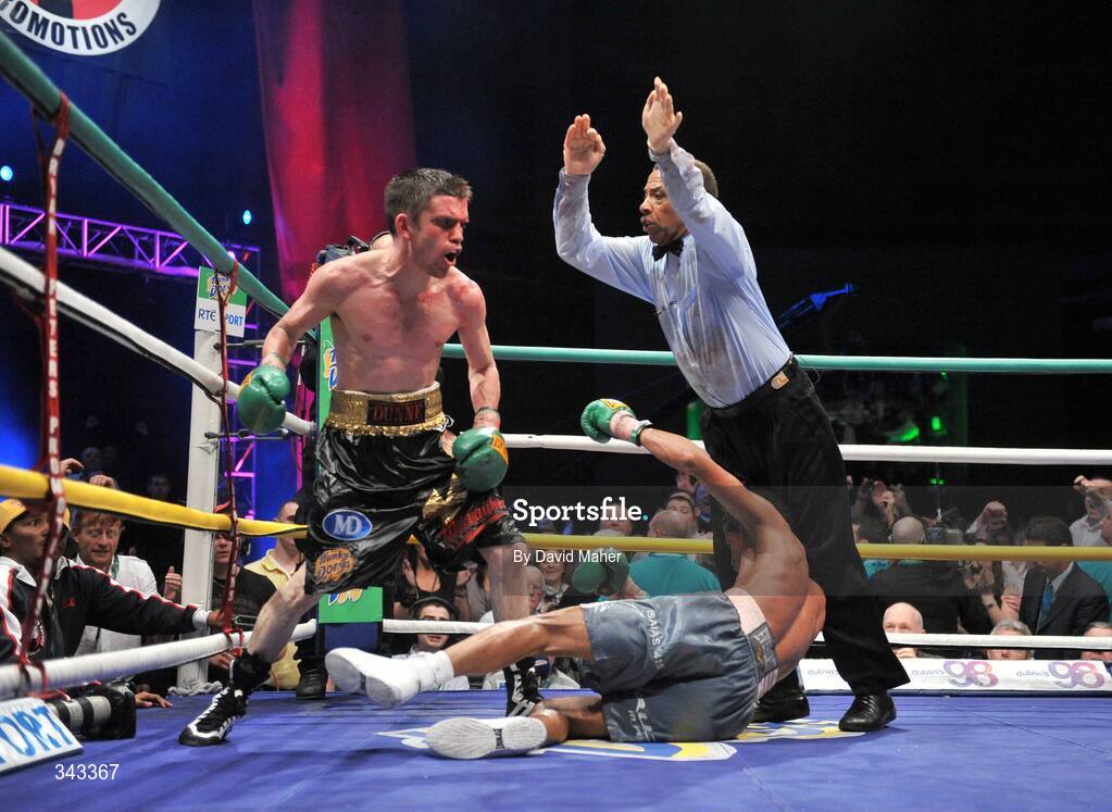 21 March 2009; Bernard Dunne knocks down Ricardo Cordoba during the eleventh round to win the WBA World Super Bantamweight title. Hunky Dory World Title Fight Night, Bernard Dunne v Ricardo Cordoba, The O2, Dublin. Picture credit: David Maher / SPORTSFILE