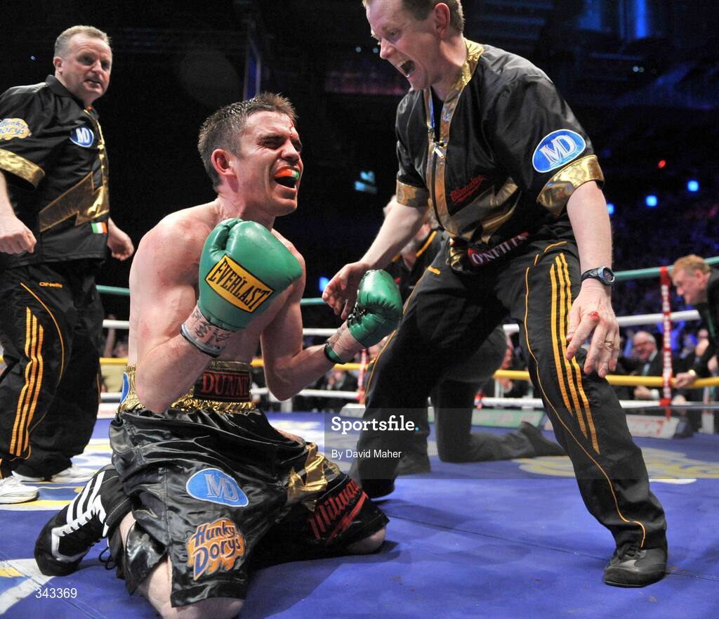 21 March 2009; Bernard Dunne celebrates with promoter Brian Peters, right, and trainer Harry Hawkins after knocking down Ricardo Cordoba during the eleventh round to win the WBA World Super Bantamweight title. Hunky Dory World Title Fight Night, Bernard Dunne v Ricardo Cordoba, The O2, Dublin. Picture credit: David Maher / SPORTSFILE