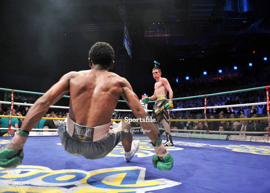 21 March 2009; Bernard Dunne knocks down Ricardo Cordoba for the second time during the eleventh round shortly before going on to win the WBA World Super Bantamweight title. Hunky Dory World Title Fight Night, Bernard Dunne v Ricardo Cordoba, The O2, Dublin. Picture credit: David Maher / SPORTSFILE