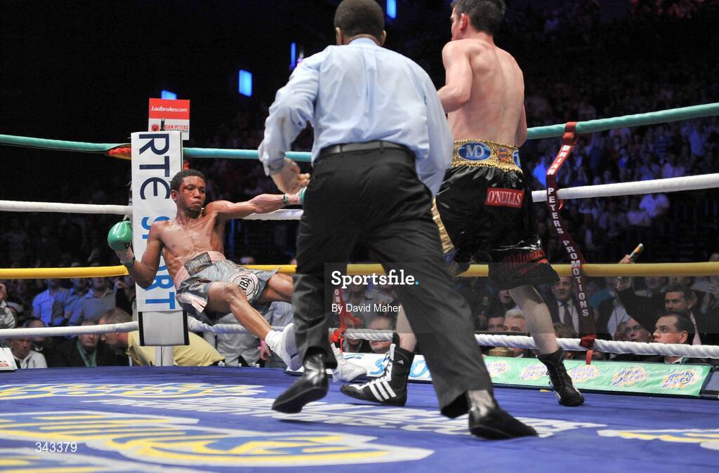 21 March 2009; Bernard Dunne knocks down Ricardo Cordoba during the eleventh round shortly before going on to win the WBA World Super Bantamweight title. Hunky Dory World Title Fight Night, Bernard Dunne v Ricardo Cordoba, The O2, Dublin. Picture credit: David Maher / SPORTSFILE