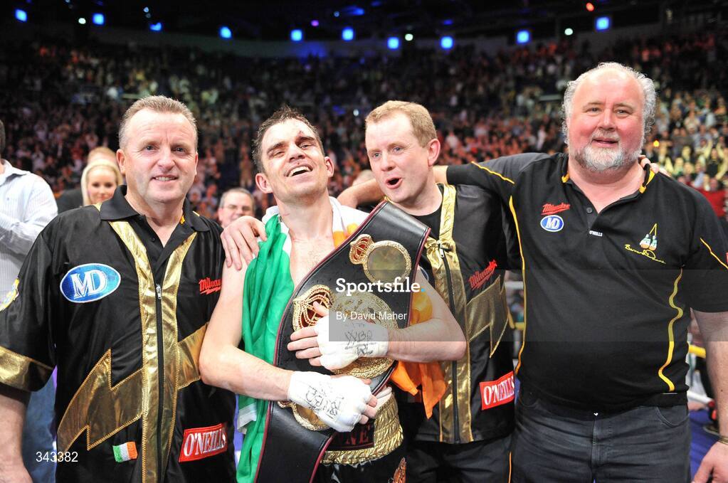 21 March 2009; Bernard Dunne celebrates with, from left, trainer Harry Hawkins, promoter Brian Peters, and sponsor Martin Donnelly, after victory over Ricardo Cordoba to win the WBA World Super Bantamweight title. Hunky Dory World Title Fight Night, Bernard Dunne v Ricardo Cordoba, The O2, Dublin. Picture credit: David Maher / SPORTSFILE