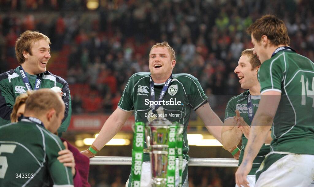21 March 2009; Ireland players, from left, Stephen Ferris, Jamie Heaslip, Tomas O'Leary and Tommy Bowe wait for captain Brian O'Driscoll to lift the RBS Six Nations trophy. RBS Six Nations Championship, Wales v Ireland, Millennium Stadium, Cardiff, Wales. Picture credit: Brendan Moran / SPORTSFILE