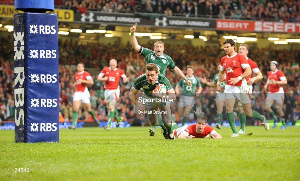 21 March 2009; Tommy Bowe, Ireland, goes over for the second try of the game despite the attention of Shane Williams, Wales. RBS Six Nations Championship, Wales v Ireland, Millennium Stadium, Cardiff, Wales. Picture credit: Matt Browne / SPORTSFILE