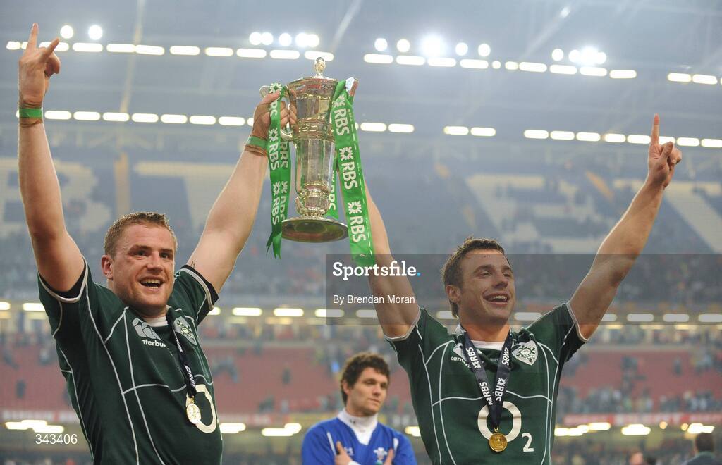 21 March 2009; Ireland's Jamie Heaslip, left, and Tommy Bowe celebrate with the RBS Six Nations trophy. RBS Six Nations Championship, Wales v Ireland, Millennium Stadium, Cardiff, Wales. Picture credit: Brendan Moran / SPORTSFILE