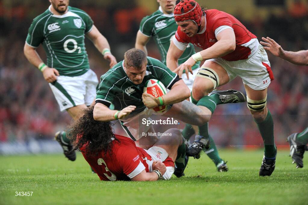 21 March 2009; Jamie Heaslip, Ireland, is tackled by Adam Jones, 3, and Alun-Wyn Jones, Wales. RBS Six Nations Championship, Wales v Ireland, Millennium Stadium, Cardiff, Wales. Picture credit: Matt Browne / SPORTSFILE