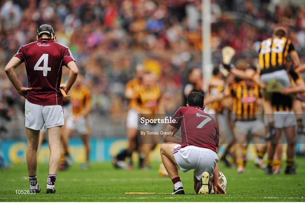 6 September 2015; Dejected Galway players Padraig Mannion, left, and Daithí Burke watch Kilkenny players celebrate after the game. GAA Hurling All-Ireland Senior Championship Final, Kilkenny v Galway, Croke Park, Dublin. Picture credit: Tomás Greally / SPORTSFILE