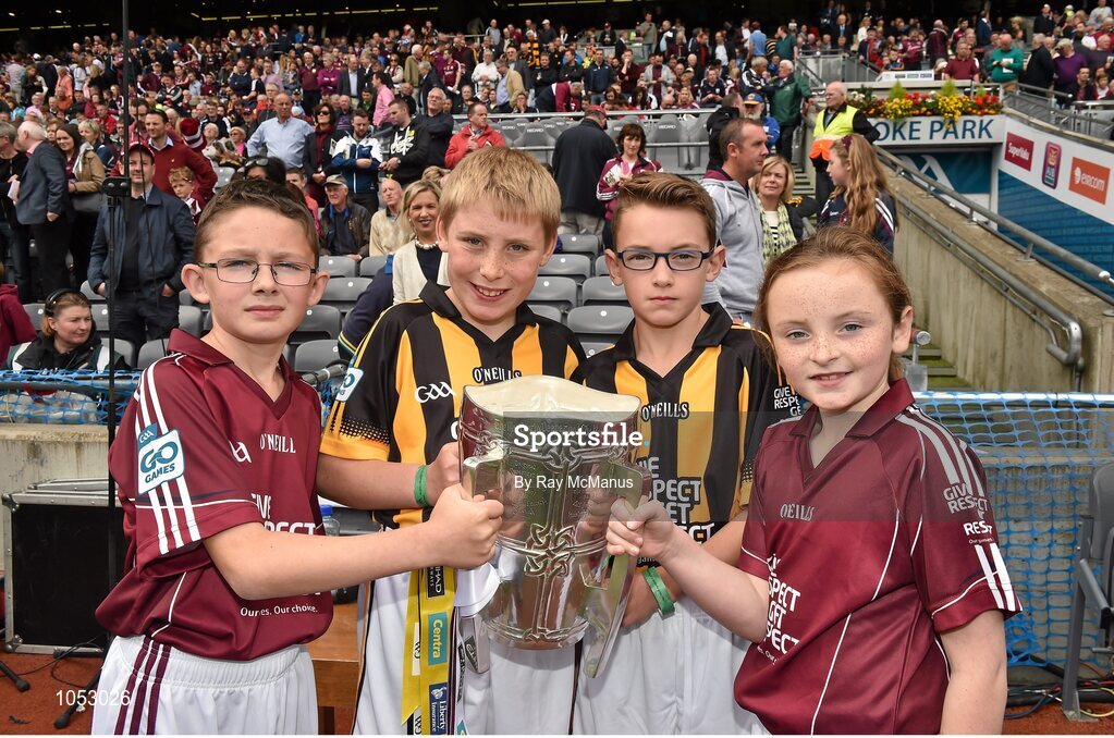 6 September 2015; Mascots bring out the Liam MacCarthy Cup before the game, left to right, Luke Lally, Menlough N.S., Co. Galway, Alex Walsh, Dunamaggin, Co. Kilkenny, Robert Ring, St. Joseph's N.S., Clinstown, Jenkinstown, Co. Kilkenny, and Michaela Gillooly, Williamstown N.S., Co. Galway. GAA Hurling All-Ireland Senior Championship Final, Kilkenny v Galway, Croke Park, Dublin. Picture credit: Ray McManus / SPORTSFILE