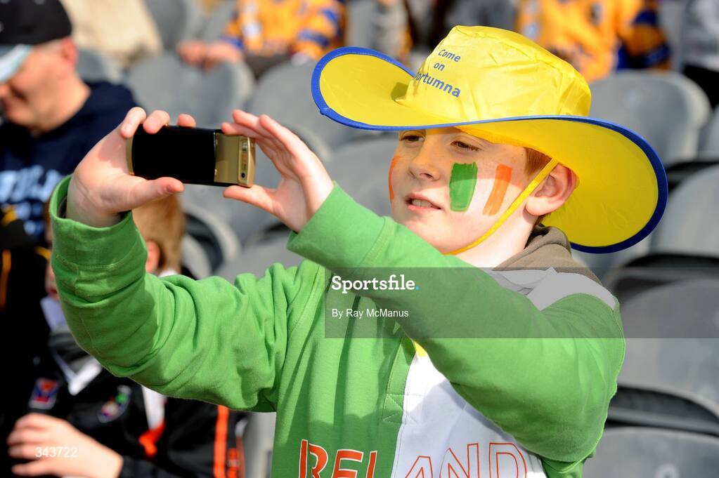 17 March 2009; Ten-year-old Eoin Campbell, from Ballymena, Co. Antrim, supporting Portumna, records a scene on his camera phone. AIB All-Ireland Senior Club Hurling Championship Final, Portumna, Co. Galway, v De La Salle, Waterford, Croke Park, Dublin. Picture credit: Ray McManus / SPORTSFILE