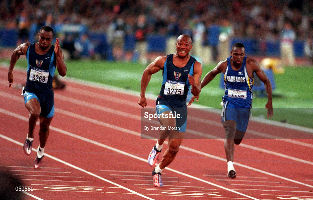 23 September 2000; Olympic Gold Medallist Maurice Greene crosses the line to win the Men's 100m final, from Jon Drummond, left and Obadele Thompsom. Stadium Australia, Sydney Olympic Park, Homebush Bay, Sydney, Australia. Photo by Brendan Moran/Sportsfile