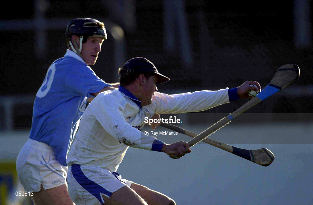 26 November 2000; Castletown keeper John Lyons clears under pressure from Denis Byrne of Graigue Ballycallan during the AIB Leinster Senior Hurling Championship Final between Graigue Ballycallan and University College Dublin at Nowlan Park in Kilkenny. Photo by Ray McManus/Sportsfile