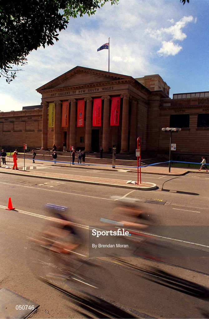 25 September 2000; Triathletes pass the Art Gallery of New South Wales during the Sydney Olympics at Sydney Olympic Park in Sydney, Australia. Photo by Brendan Moran/Sportsfile