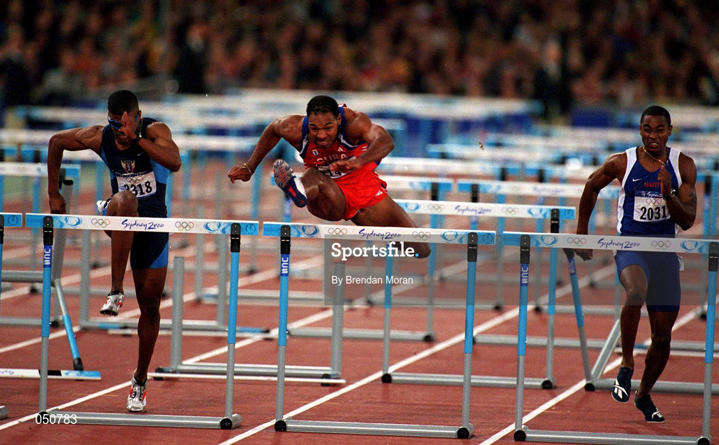 25 September 2000; Anier Garcia of Cuba, centre, comes over the last hurdle ahead of Terence Trammell of USA in the mens 110m Hurdles during the Sydney Olympics at Sydney Olympic Park in Sydney, Australia. Photo by Brendan Moran/Sportsfile