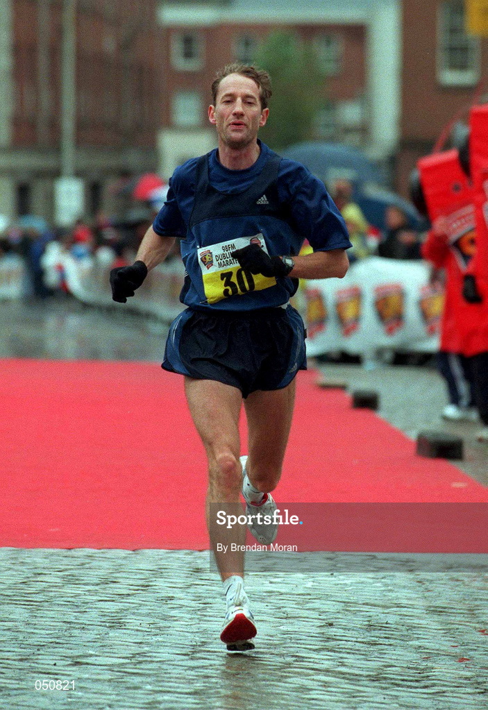 30 October 2000; Cathal O'Connell of Ireland crosses the line during the 98FM Dublin City Marathon in Dublin. Photo by Brendan Moran/Sportsfile