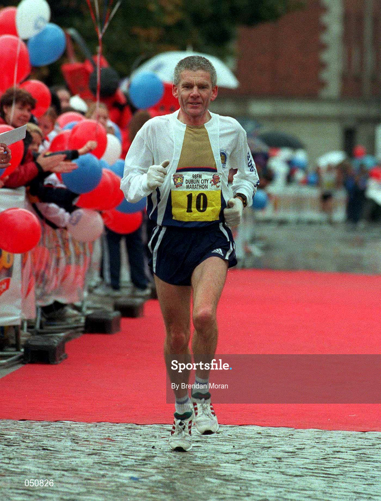 30 October 2000; John Griffin of Ireland crosses the line during the 98FM Dublin City Marathon in Dublin. Photo by Brendan Moran/Sportsfile