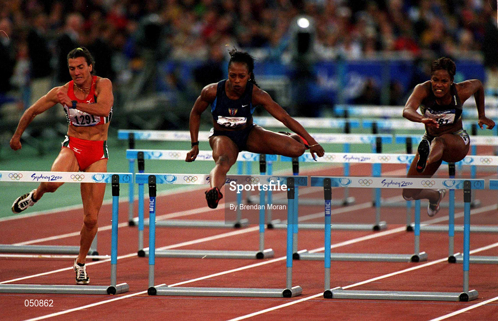 25 September 2000; Gail Devers of USA, centre competing in the womens 110m hurdles during the Sydney Olympics at Sydney Olympic Park in Sydney, Australia. Photo by Brendan Moran/Sportsfile