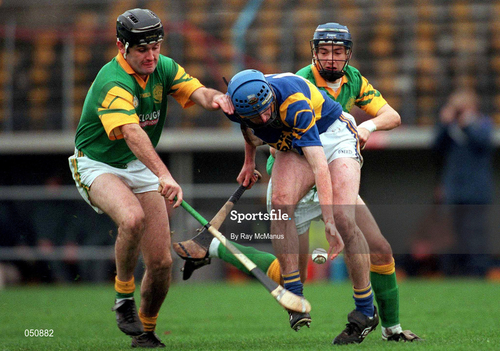 30 October 2000; Paul O'Grady of Patrickswell is challenged by Brendan Dunne of Toomevara during the AIB Munster Club Hurling Championship match between Patrickswell and Toomevara at Semple Stadium in Thurles, Tipperary. Photo by Ray McManus/Sportsfile