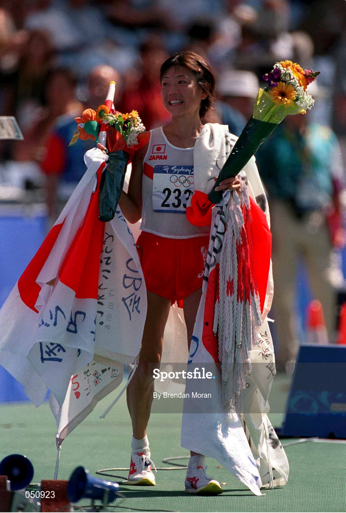 25 September 2000; Japan's Naoko Takahasi celebrates after winning gold in the womens marathon during the Sydney Olympics at Sydney Olympic Park in Sydney, Australia. Photo by Brendan Moran/Sportsfile
