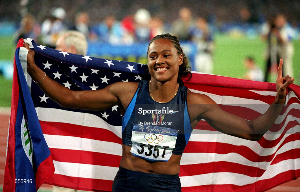 23 September 2000; USA's Marion Jones, celebrates after winning the gold medal in the womens 100m final. Stadium Australia, Sydney Olympic Park, Homebush Bay, Sydney, Australia. Photo by Brendan Moran/Sportsfile