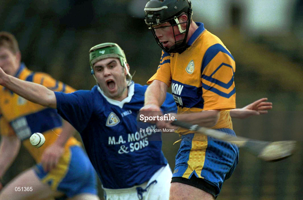 26 November 2000; Brian Colbert of Sixmilebridge gets his shot despite the attentions of Keith O'Connor of Mount Sion during the AIB Munster Club Hurling Championship Final match between Sixmilebridge and Mount Sion at Semple Stadium in Thurles, Tipperary. Photo by Brendan Moran/Sportsfile
