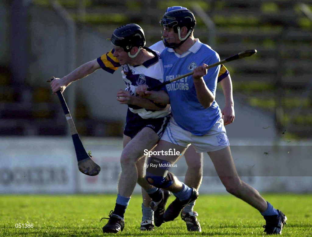 26 November 2000; Hugh Flannery of UCD is tackled by John Hoyne of Graigue Ballycallan during the AIB Leinster Senior Hurling Championship Final between Graigue Ballycallan and University College Dublin at Nowlan Park in Kilkenny. Photo by Ray McManus/Sportsfile