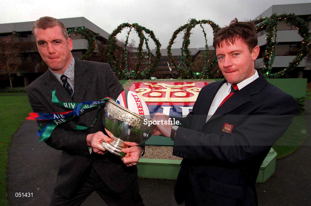 30 November 2000; Captain of defending champions St Mary's College, Victor Costello, attempts to get away with the trophy from Michael Hennessy, Group Security Services, AIB, at the launch of this year's AIB All-Ireland League at the AIB Bankcentre, Ballsbridge, Dublin. St Mary's begin their defence of the title this weekend against former champions Young Munster at Templeville Road. Rugby. Picture credit; Brendan Moran/SPORTSFILE