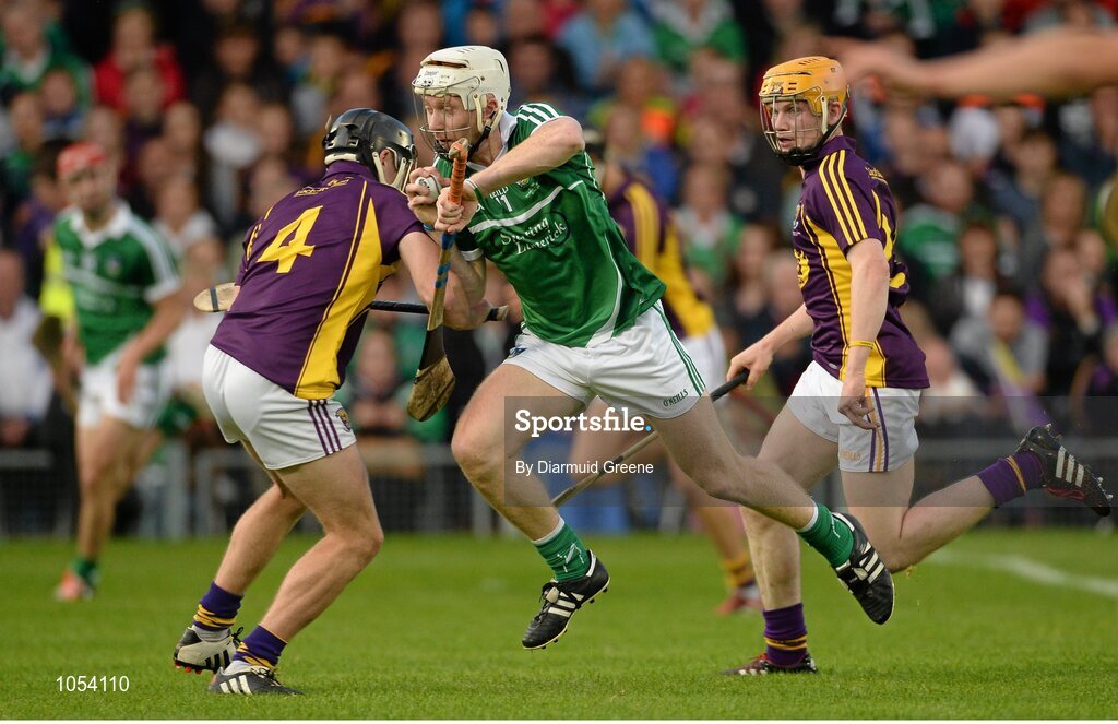 12 September 2015; Cian Lynch, Limerick, in action against Eoin Conroy, left, and Simon Donohoe, Wexford. Bord Gais Energy GAA Hurling All-Ireland U21 Championship Final, Limerick v Wexford, Semple Stadium, Thurles, Co. Tipperary. Picture credit: Diarmuid Greene / SPORTSFILE